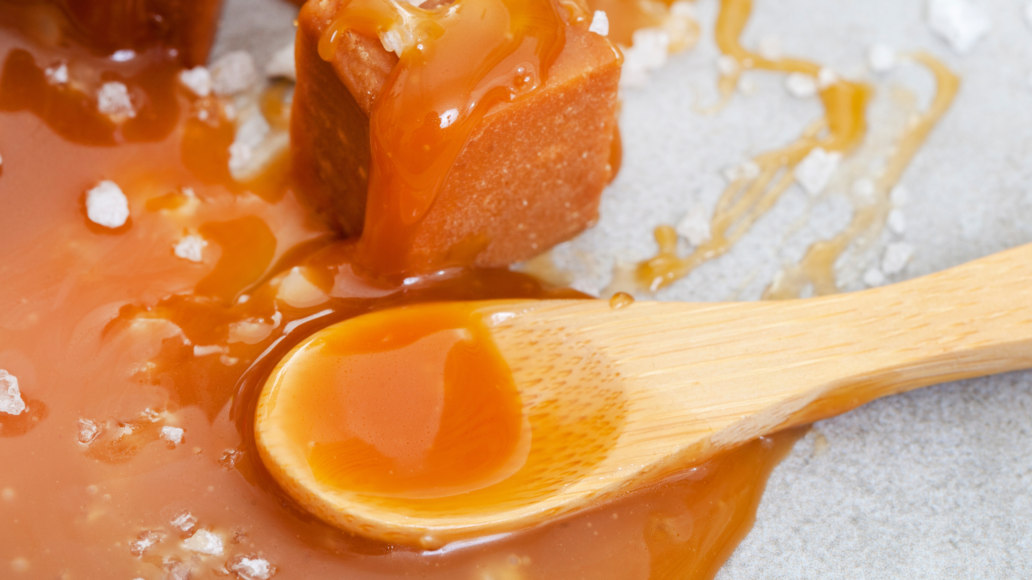 Homemade salted caramel sauce in a jar.